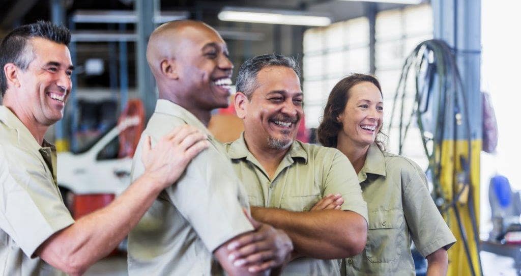 three men and a woman workers image