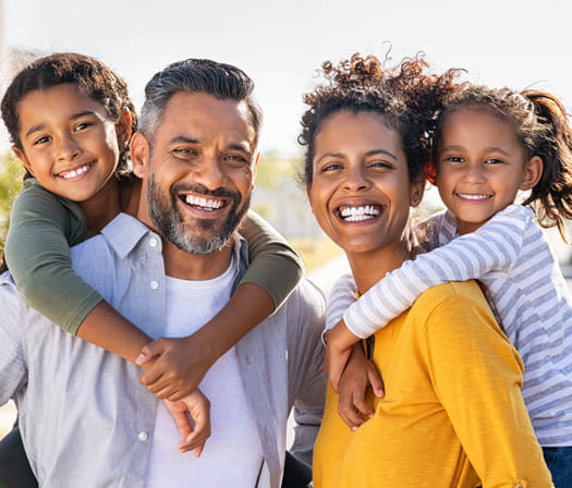 Hispanic family of four 525x448 image